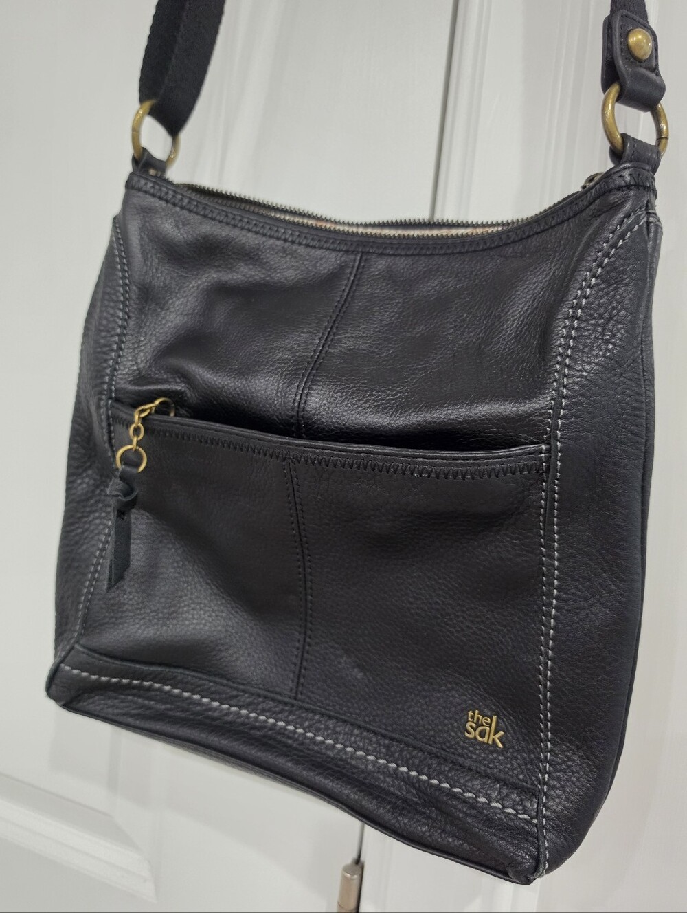 The Sak Black Leather Shoulder Bag with Gold Accents